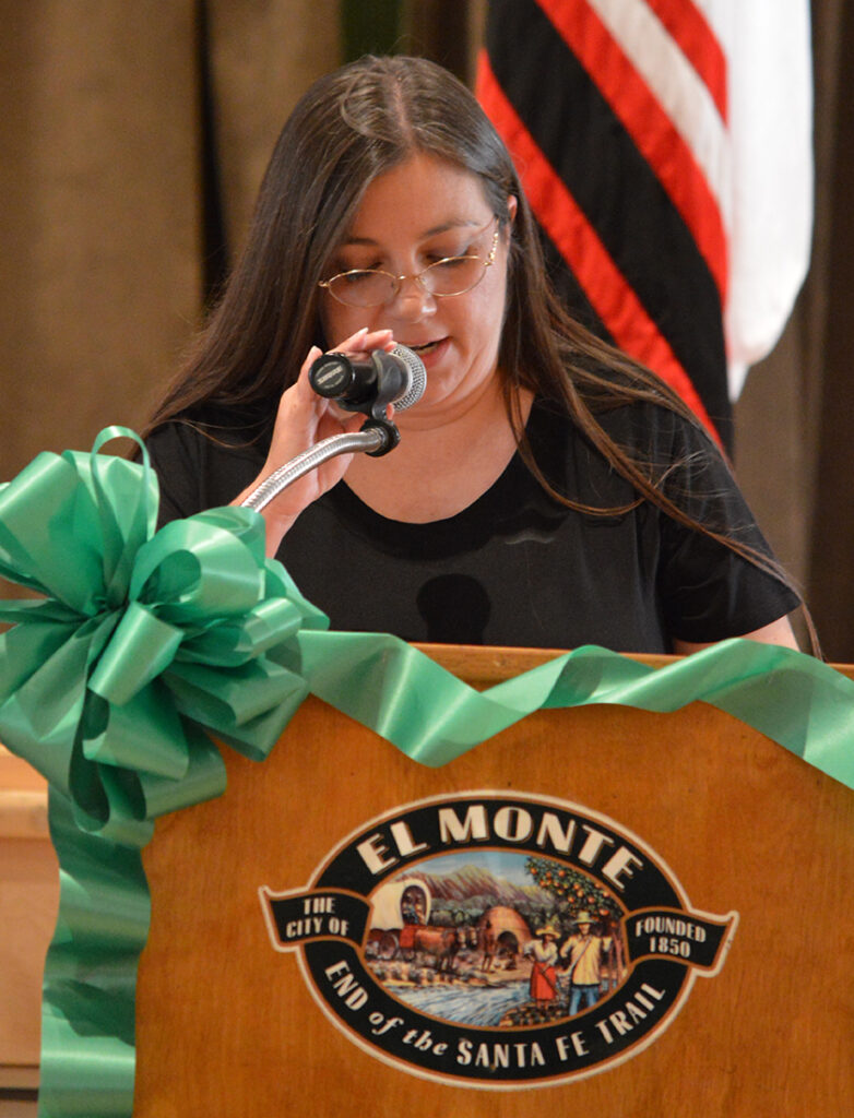 Sandonne Goad speaking at podium